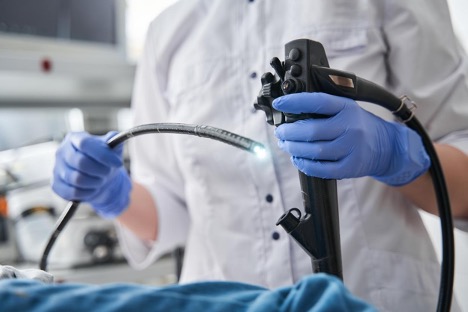 doctor-holding-endoscope-endoscopy-concept