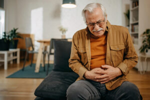 Senior man has stomachache because of his IBS