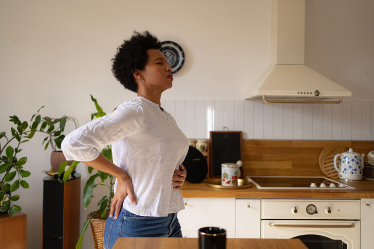 A person standing in a kitchen